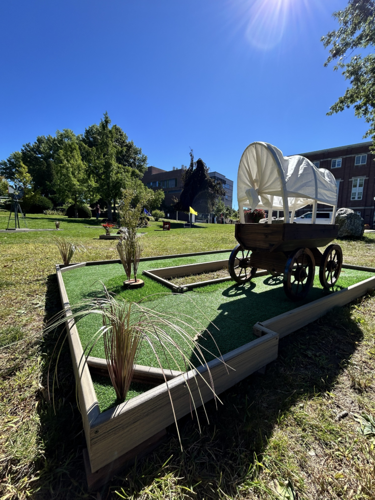 covered wagon mini golf obstacle on western course