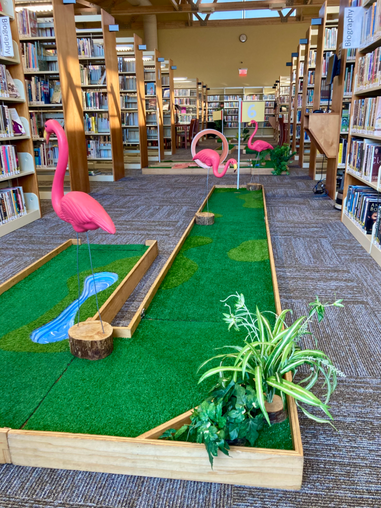 flamingo obstacles on mini golf course in library