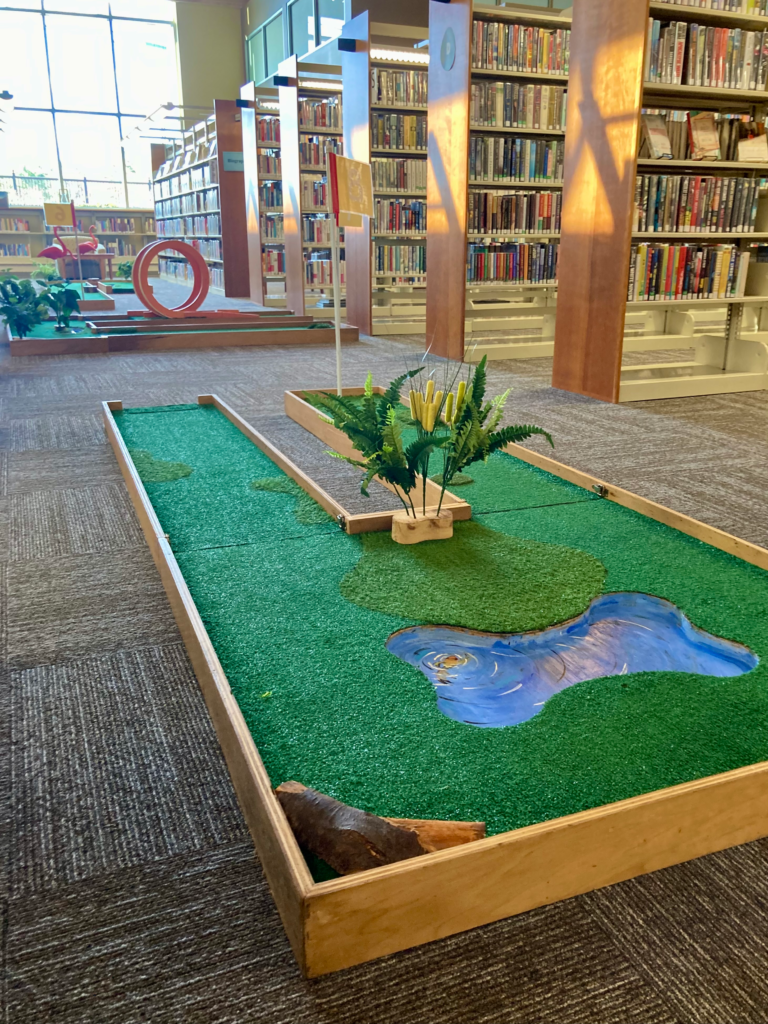 water trap mini golf hole in library